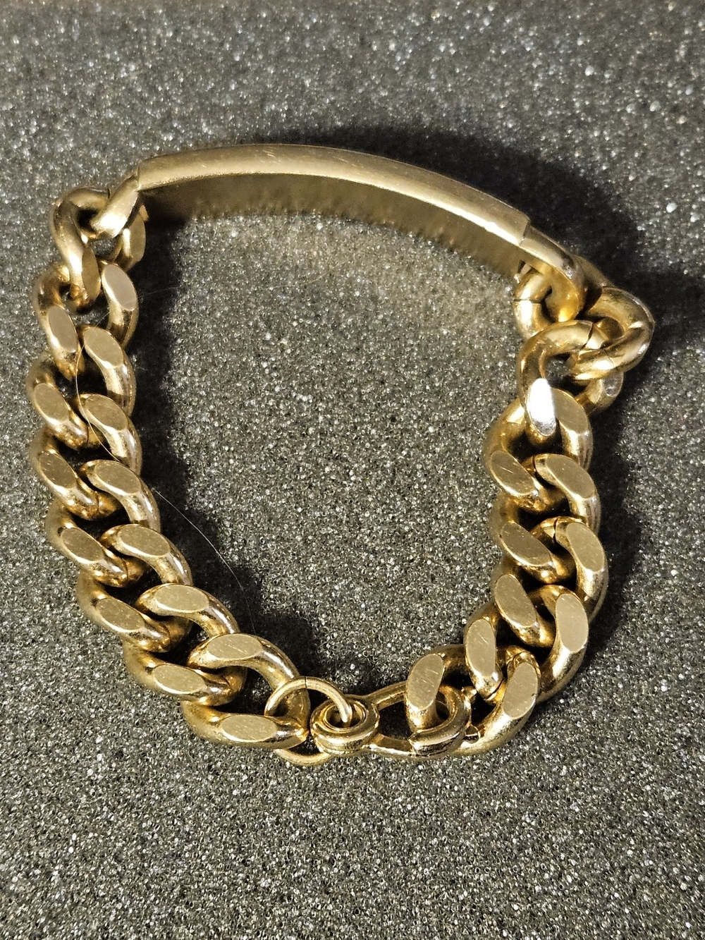 Vintage gold-tone curb-link ID bracelet signed SWANK on the Back identification